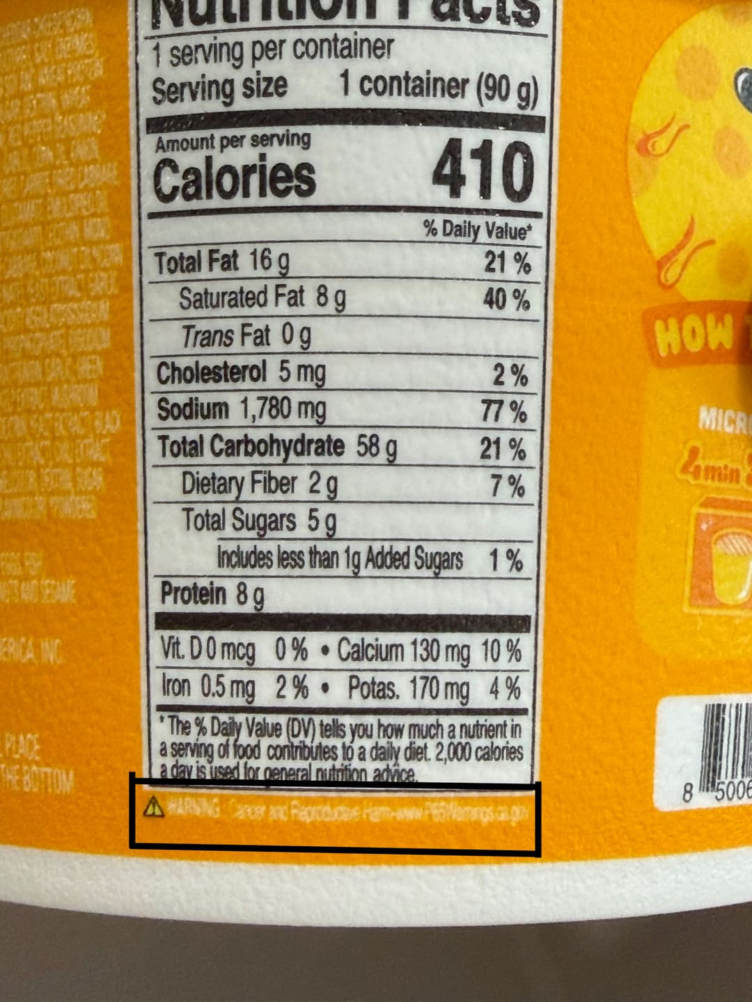 Nutrition label on the ramen cup with a California Prop 65 cancer warning highlighted at the bottom